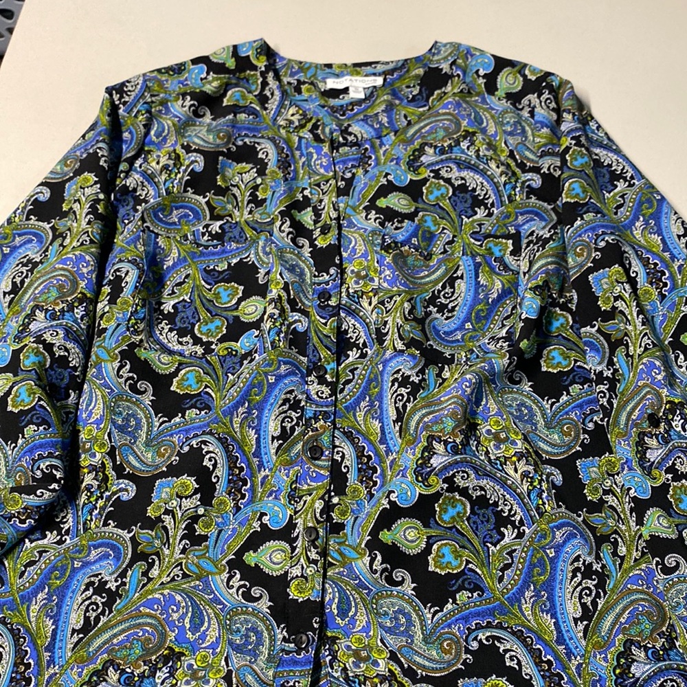 Green and blue paisley print blouse black background